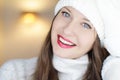 Christmas, people and winter holiday concept. Happy smiling woman wearing white knitted hat as closeup face xmas Royalty Free Stock Photo