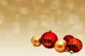 Christmas perfect decoration red and gold yellow balls isolated on golden blurred bokeh background Royalty Free Stock Photo