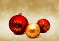 Christmas perfect decoration red and gold yellow balls isolated on golden blurred bokeh background Royalty Free Stock Photo