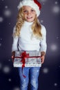 Christmas photo of cute little blond girl with presents Royalty Free Stock Photo