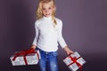 Christmas photo of cute little blond girl with presents Royalty Free Stock Photo