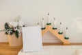 Christmas photo frame mock up template with decoration on wooden table. Royalty Free Stock Photo