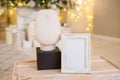 Christmas photo frame mock up template with decoration on wooden table. Royalty Free Stock Photo