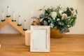 Christmas photo frame mock up template with decoration on wooden table. Royalty Free Stock Photo