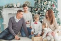 Christmas photo of large family. joy and happiness concept. portrait of large family gathering. sitting on floor, getting gifts, Royalty Free Stock Photo