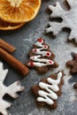 Christmas picture. Chocolate gingerbread Christmas trees and snowflakes sprinkled with flour on a dark background Royalty Free Stock Photo