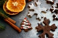 Christmas picture. Chocolate gingerbread Christmas trees and snowflakes sprinkled with flour on a dark background