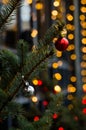 Building decorated with a New Year Christmas tree with matte silver and red balls