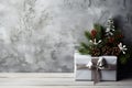 Christmas pine tree and red cherry, balls and white gift boxes decoration on vintage white stucco wall background Royalty Free Stock Photo