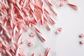 Christmas pink candies on white tabletop. Generate ai