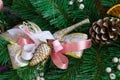 Christmas pink ribbon on green New Year tree branch