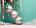 Christmas pink and turquoise balls and Christmas decor on a turquoise background. copy space