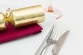 Christmas place setting with gold cracker Royalty Free Stock Photo