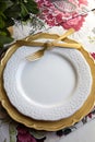 Christmas place setting, gold and flowers Royalty Free Stock Photo