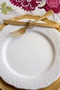 Christmas place setting, gold and flowers Royalty Free Stock Photo