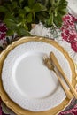 Christmas place setting, gold and flowers Royalty Free Stock Photo