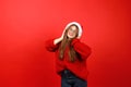 Christmas playlist, a girl in headphones and a red sweater dances to the music. New Year celebration Royalty Free Stock Photo