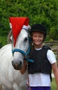 Christmas pony with little girl rider Royalty Free Stock Photo