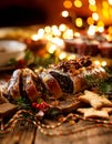 Christmas poppy seed cake, sliced poppy seed cake covered with icing and decorated with raisins and walnuts on the holiday table. Royalty Free Stock Photo