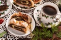 Christmas poppy seed chocolate cake and a cup of coffee on festive table top view Royalty Free Stock Photo