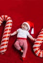 Christmas portrait of adorable newborn baby wearing Santa Claus` outfit. Top view Royalty Free Stock Photo