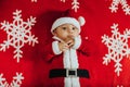Christmas portrait of adorable newborn baby wearing Santa Claus` outfit Royalty Free Stock Photo