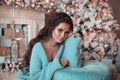 Christmas Portrait of Beautiful brunette girl wears in turquoise Royalty Free Stock Photo