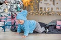 Christmas portrait of cute little newborn baby boy, dressed in christmas clothes and wearing santa hat, studio shot, winter time Royalty Free Stock Photo