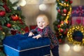 Christmas portrait of cute little newborn baby boy, dressed in christmas clothes and wearing santa hat, studio shot, winter time Royalty Free Stock Photo