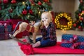 Christmas portrait of cute little newborn baby boy, dressed in christmas clothes and wearing santa hat, studio shot, winter time Royalty Free Stock Photo