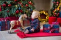 Christmas portrait of cute little newborn baby boy, dressed in christmas clothes and wearing santa hat, studio shot, winter time Royalty Free Stock Photo