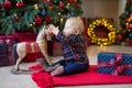 Christmas portrait of cute little newborn baby boy, dressed in christmas clothes and wearing santa hat, studio shot, winter time Royalty Free Stock Photo