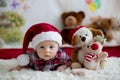 Christmas portrait of cute little newborn baby boy, dressed in christmas clothes Royalty Free Stock Photo