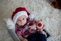 Christmas portrait of cute little newborn baby boy, dressed in christmas clothes Royalty Free Stock Photo