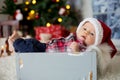 Christmas portrait of cute little newborn baby boy, dressed in christmas clothes Royalty Free Stock Photo