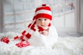 Christmas portrait of cute little newborn baby boy, wearing santa hat