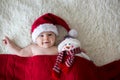 Christmas portrait of cute little newborn baby boy, wearing santa hat Royalty Free Stock Photo