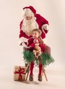 Christmas portrait of cute little newborn baby girl, dressed in christmas clothes, studio shot, winter time Royalty Free Stock Photo