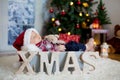 Christmas portrait of cute sleeping newborn baby boy, dressed in christmas clothes Royalty Free Stock Photo
