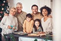 Christmas, portrait and family cooking cookies in home kitchen, bond and together. Xmas, baking food and happy face of Royalty Free Stock Photo