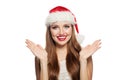 Christmas portrait of pretty surprised woman in santa claus hat isolated on white Royalty Free Stock Photo
