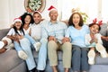 Christmas, portrait and smile of big family on sofa in home living room, bonding and laughing at funny joke. Love, xmas Royalty Free Stock Photo