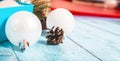 Christmas postcard design. Striped red and white Christmas decorations, balls, candy canes on blue wooden background. Flat lay, Royalty Free Stock Photo