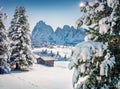 Fabulous winter view of Alpe di Siusi village with Plattkofel peak on background.