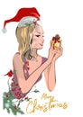 Christmas poster with a beautiful fashion girl with a gift in her hands. Royalty Free Stock Photo