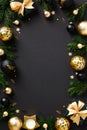 Christmas poster design. Luxury golden balls, decorations, Christmas tree branches, gift boxes on black background. Vertical New