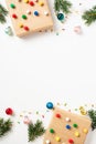 Christmas poster, vertical banner design. Flat lay handmade gift boxes, colorful decorations, fir branches, garland, balls on Royalty Free Stock Photo