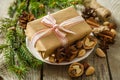 Christmas preasent nuts cinnamon ribbon Royalty Free Stock Photo