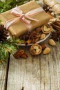 Christmas preasent nuts cinnamon ribbon Royalty Free Stock Photo