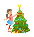 Christmas Preparation, Girl Decorating Pine Tree Royalty Free Stock Photo